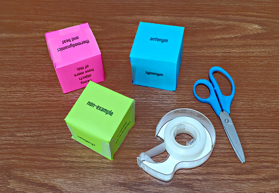 assembled concept cubes in blue, pink, and green